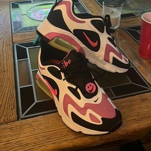 Nike, pink, black, lime green. Smiley. Detachable Nike sign.